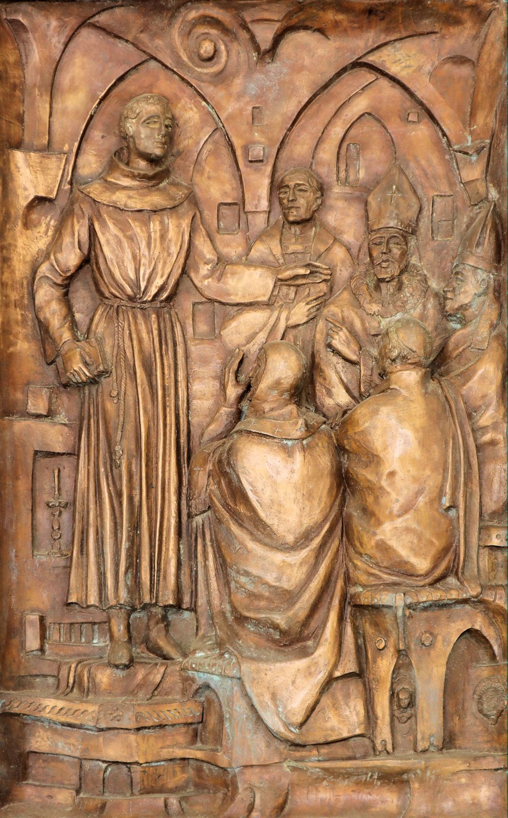Johannes predigt, Bronzerelief am Portal der Franziskanerkirche in Capestrano