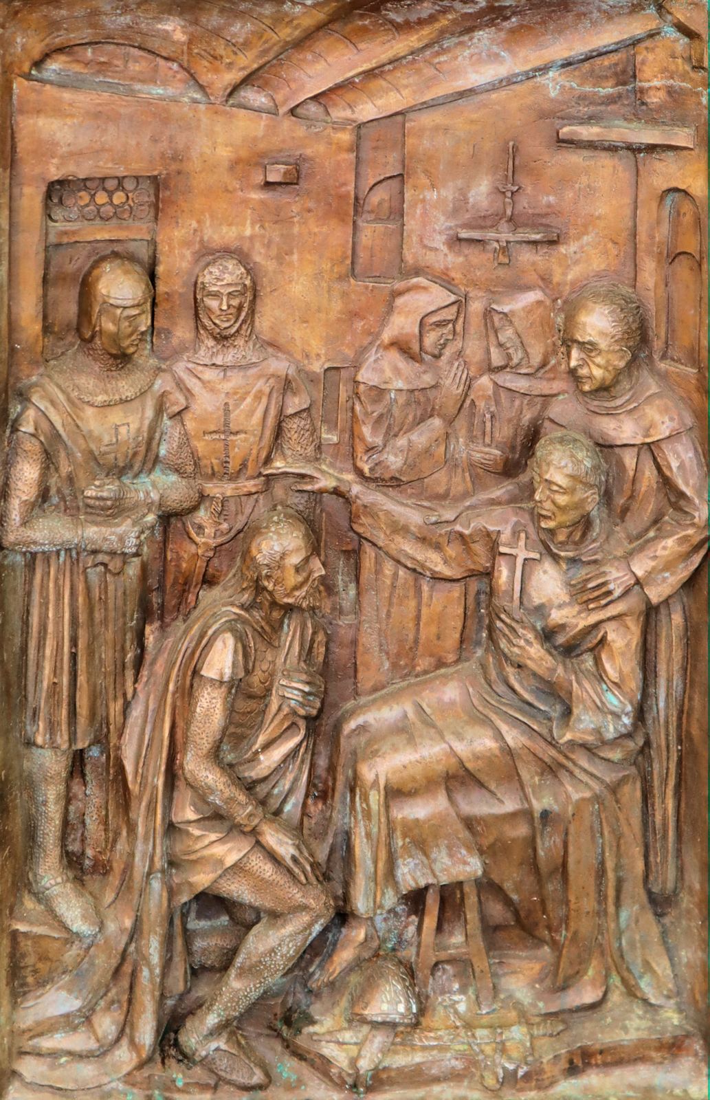 der sterbende Johannes segnet, Bronzerelief am Portal der Franziskanerkirche in Capestrano