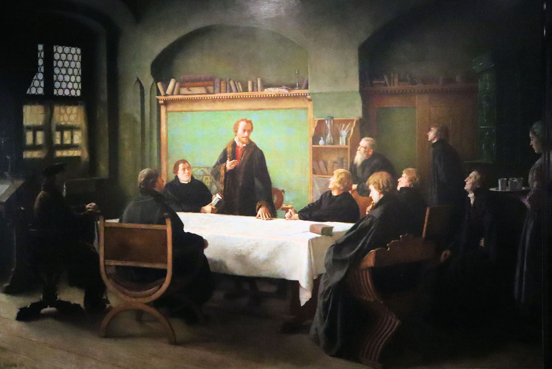 Melanchton lehrt, links neben ihm sitzt Luther, Bild  im Melanchtonhaus in Wittenberg