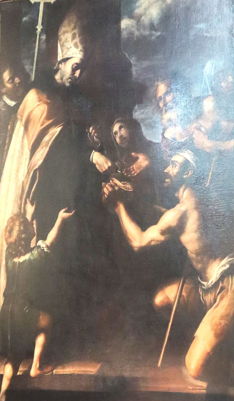Tommaso Luini, genannt Caravaggino (zugeschrieben): Thomas hilft einem Bettler, um 1630, im Sanktuarium della Madonna del Buon Consiglio in Genazzano